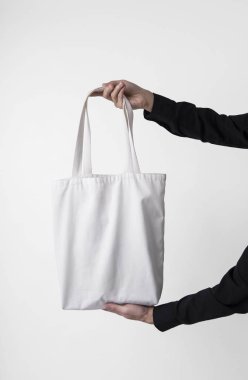 Çanta Tuval kumaş mockup boş şablon gri arka plan üzerinde izole için holding. 