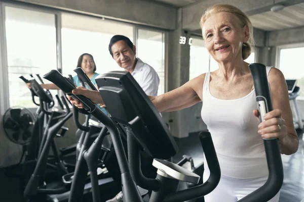 Group friend of senior runner at gym fitness smiling and happy.  elderly healthy lifestyle.