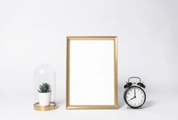 golden photo frame mock up and clock Interior decor home elements.