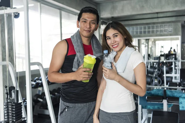 Young sport people are holding bottle — Stock Photo, Image