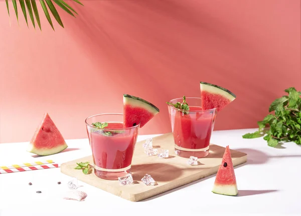 Fresh water melon juice and watermelon slice on red background. — Stock Photo, Image