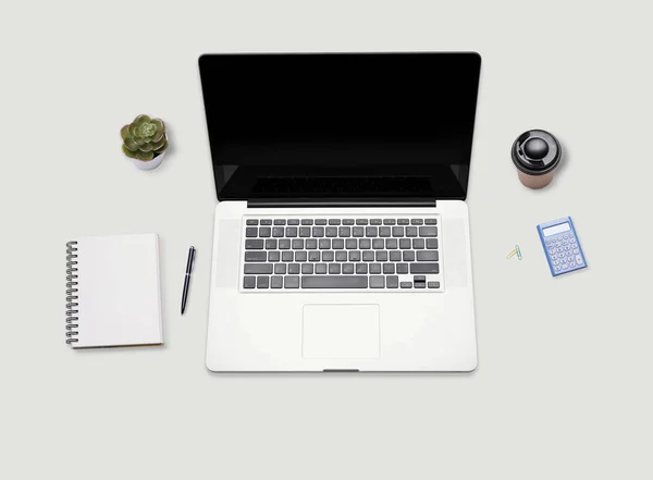 Escrivaninha com computador portátil e material de escritório . — Fotografia de Stock