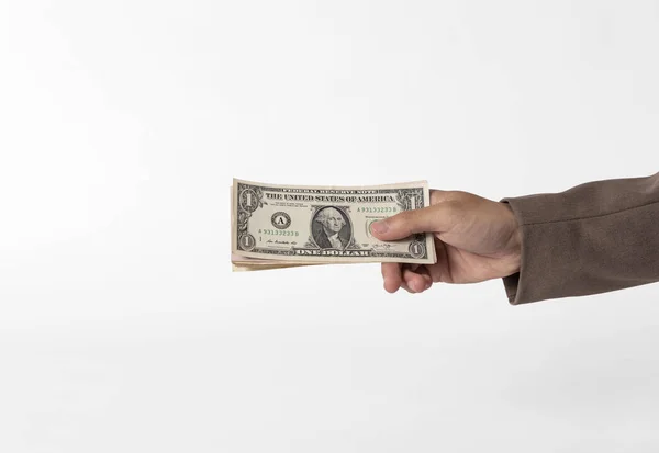 Hand holding money isolated on white background. — Stock Photo, Image