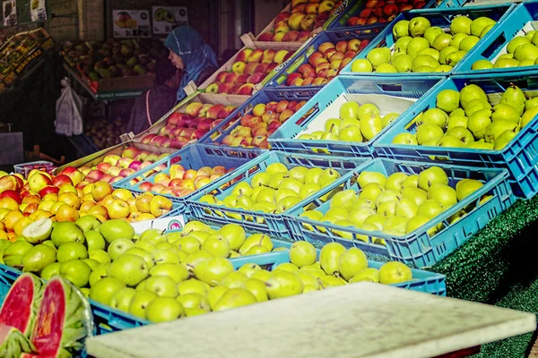 Market trade on street in modern European city. Turkish quarter. Closeup of fruit in boxes