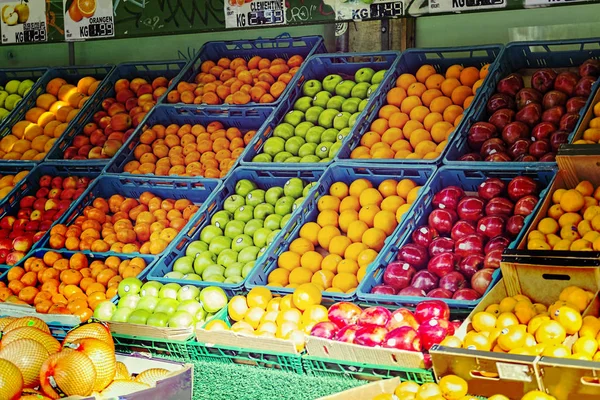 Market trade on street in modern European city. Turkish quarter. Closeup of fruit in boxes