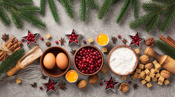 Banner Christmas baking background with Ingredients for cooking xmas baking, grey background, top view, close up