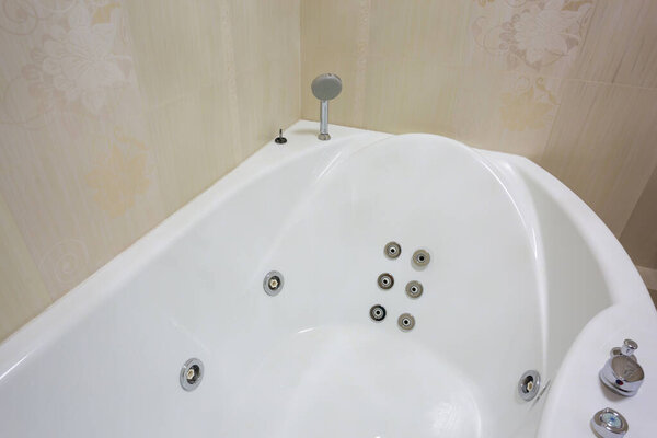 Modern bathroom with jacuzzi bath, apartment comfort,