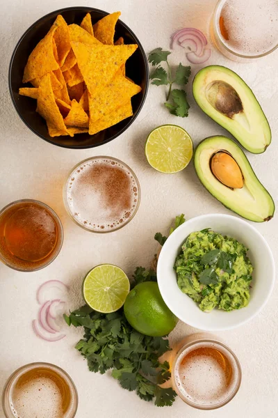 light Mexican snack or dinner Guacamole, corn chips and beer,