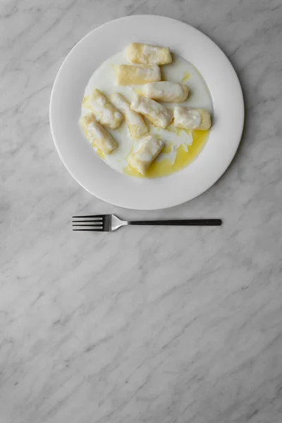 Closeup of dumplings with cottage cheese or Dumplings without filling - slavic light dish, vegetarian food, healthy breakfast, top view — Stock Photo, Image