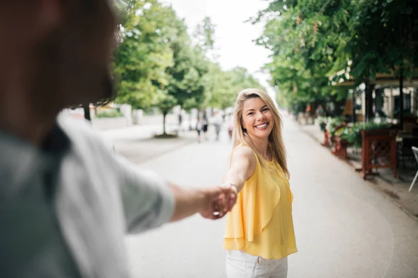 Young Woman Holding Man Hand Leading Him City Street — Stock Photo, Image