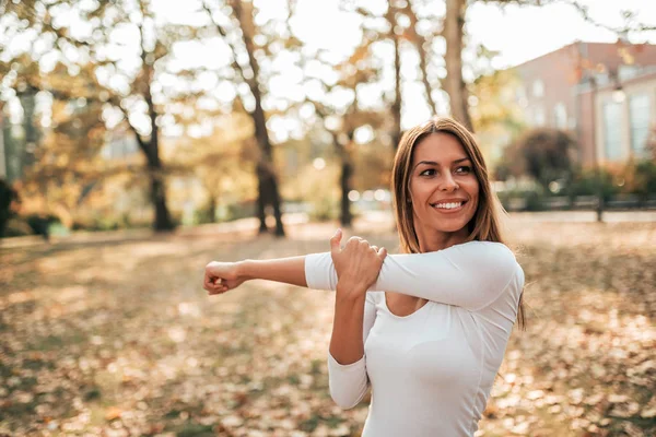 Smiling Young Woman Doing Stretch Exercises Park — Stock Photo, Image