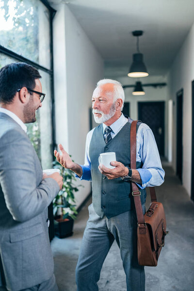 Modern senior business man on a break with colleague.