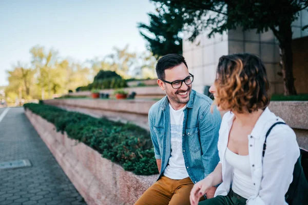 Dating concept. Two young people talking outdoors.