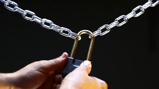 Closed Lock Steel Chain Hanging Black Background Man Tries Closed — Stock Video