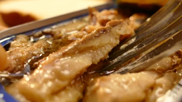 Fork to nourish delicious sprats. Canned fish. Fish fat — Stock Footage Fork to nourish delicious sprats. Canned fish. Fish fat Stock Footage