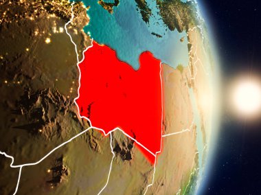 Libya red Planet Earth görünür ülke sınırları ile vurgulanmış gündoğumu sırasında. 3D çizim. Nasa tarafından döşenmiş bu görüntü unsurları.