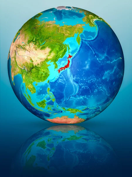 Japan in red on model of planet Earth on reflective blue surface. 3D illustration. Elements of this image furnished by NASA.
