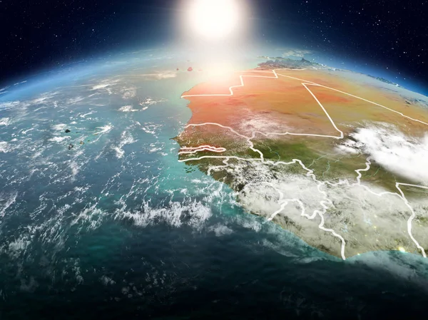 Sunrise modeli görünür ülke sınırları ile uzayda Dünya gezegeninin bir kırmızı vurgulanır Gambiya yukarıda. 3D çizim. Nasa tarafından döşenmiş bu görüntü unsurları.