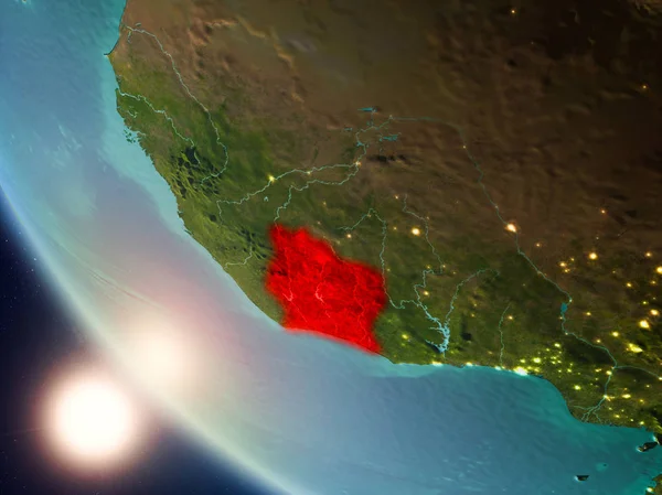 Satellite view of Ivory Coast highlighted in red on planet Earth with visible country borders during sunset. 3D illustration. Elements of this image furnished by NASA.