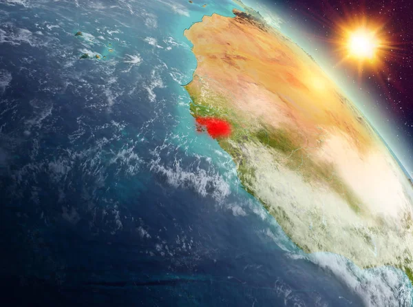 Sunrise yukarıda Gine-Bissau modeli gezegeninin uzaydaki bir kırmızı vurgulanır. 3D çizim. Nasa tarafından döşenmiş bu görüntü unsurları.