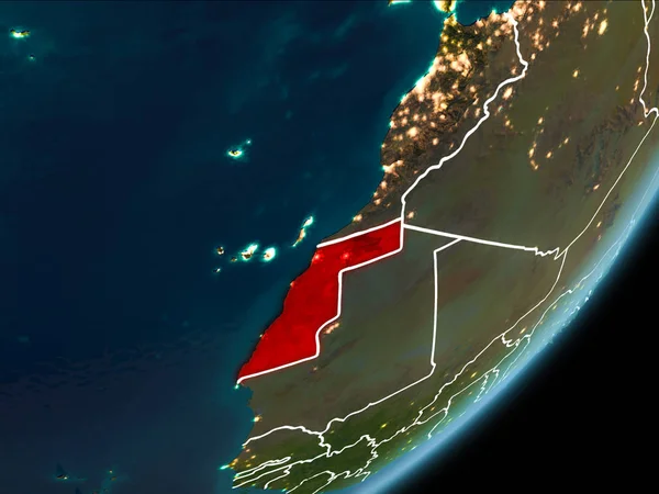 Western Sahara as seen from Earth orbit on planet Earth at night highlighted in red with visible borders and city lights. 3D illustration. Elements of this image furnished by NASA.
