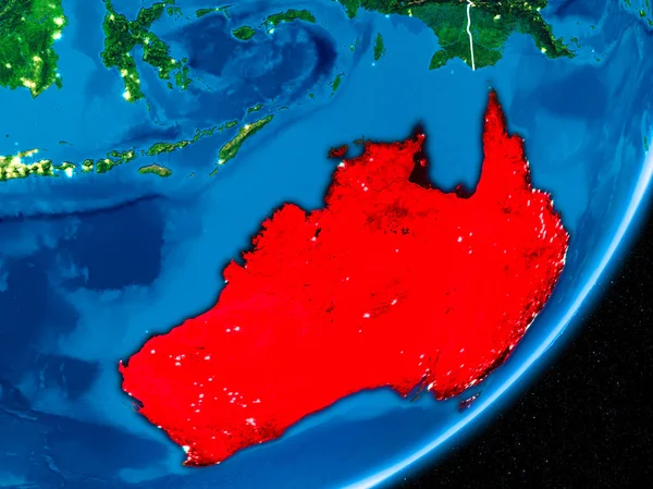 Australia in red on planet Earth at night with visible borderlines and city lights. 3D illustration. Elements of this image furnished by NASA.