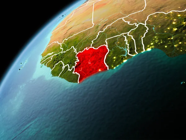 Illustration of Ivory Coast as seen from Earth orbit in late evening with visible border lines and city lights. 3D illustration. Elements of this image furnished by NASA.