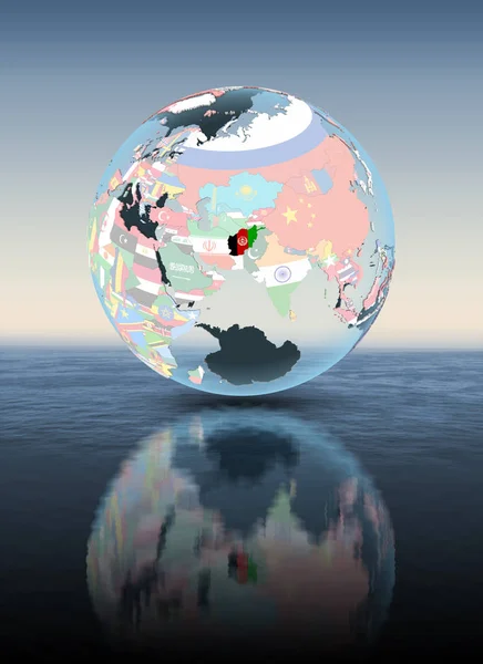 Afghanistan on political globe floating above water. 3D illustration.