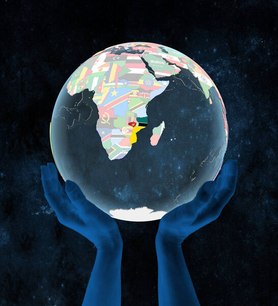 Mozambique on translucent political globe in hands in space. 3D illustration.