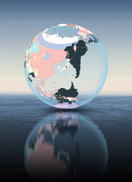 Japan on political globe floating above water. 3D illustration.