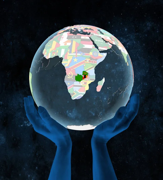 Zambia on translucent political globe in hands in space. 3D illustration.