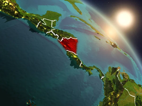 Sunset above Nicaragua from space on planet Earth with visible country borders. 3D illustration. Elements of this image furnished by NASA.