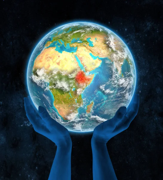 埃塞俄比亚在地球上的手在太空 — 图库照片