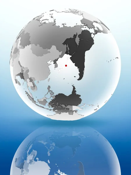 Japan with flag on globe reflecting on shiny surface. 3D illustration.