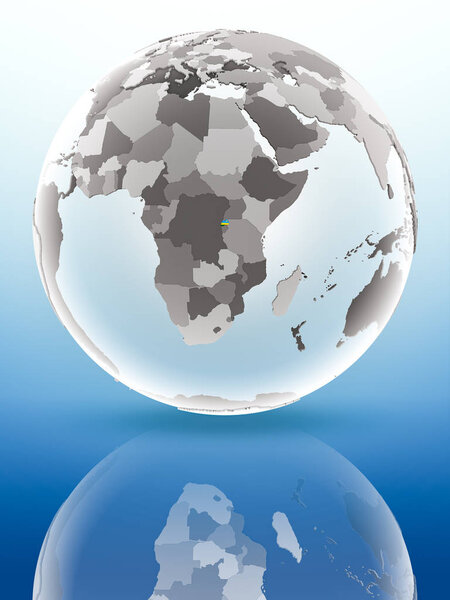 Rwanda with flag on globe reflecting on shiny surface. 3D illustration.