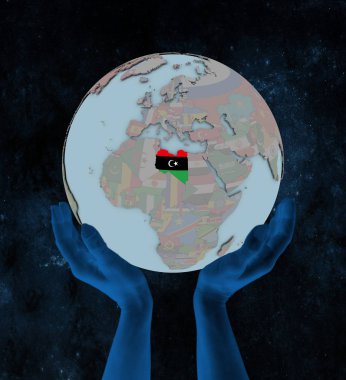 Libya bayrağı elinde uzayda dünya üzerinde. 3D çizim.