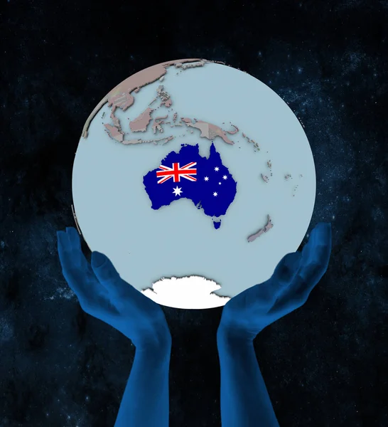 Australia with flag on globe in hands in space. 3D illustration.