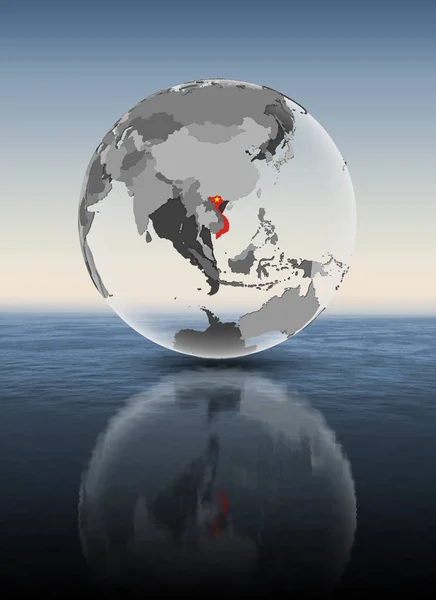 越南在水面上的半透明地球仪上有国旗 — 图库照片