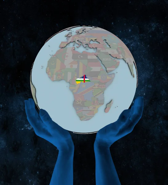 Central Africa with flag on globe in hands in space. 3D illustration.