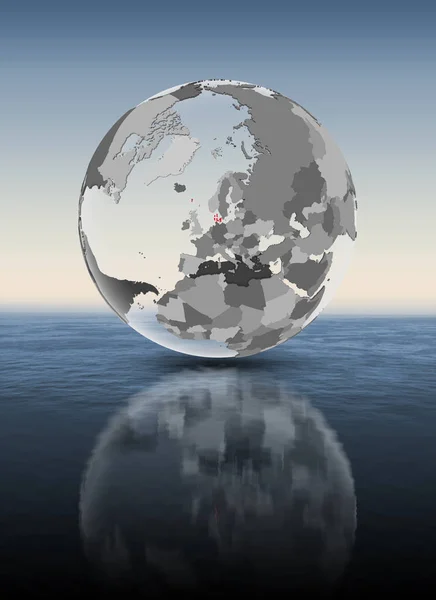 丹麦与旗子在半透明的地球在水之上 — 图库照片
