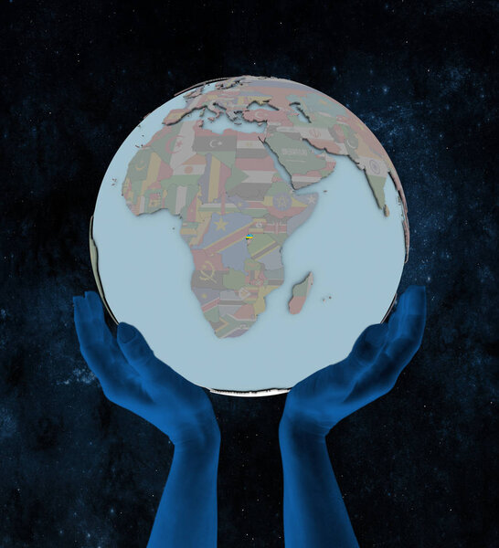 Rwanda with flag on globe in hands in space. 3D illustration.