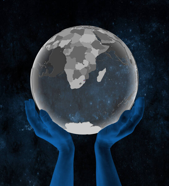 Swaziland With flag on translucent globe in hands in space. 3D illustration.