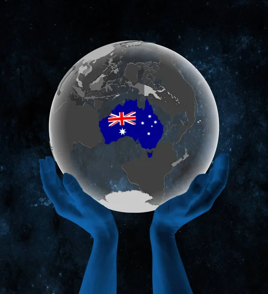 Australia With flag on translucent globe in hands in space. 3D illustration.