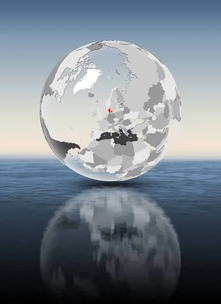 丹麦在红色在透明地球漂浮在水之上 — 图库照片