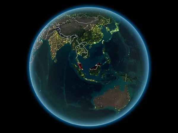 Malaysia in red with visible country borders and city lights from space at night. 3D illustration. Elements of this image furnished by NASA.