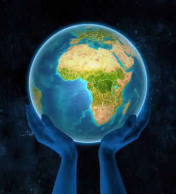 Ekvator Ginesi Planet Earth ile görünür ülke sınırları uzayda elinde. 3D çizim.