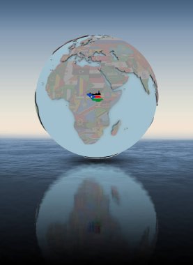 Güney Sudan dünya yukarıda su yüzeyi üzerinde ulusal bayrak ile. 3D çizim.