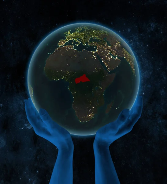 Central Africa on night Earth in hands in space. 3D illustration.