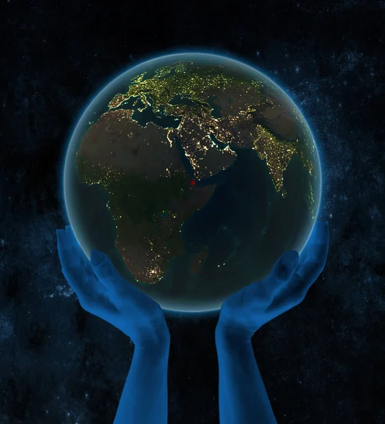 吉布提在夜间地球上的手在空间 — 图库照片