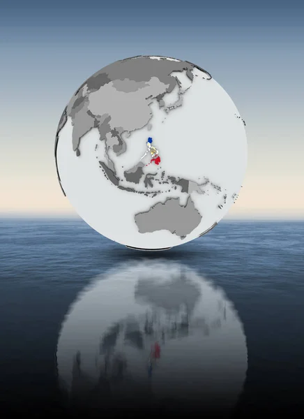 Philippines with flag on globe above water. 3D illustration.
